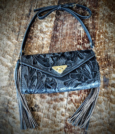 Clutch purse black with shoulder strap.
