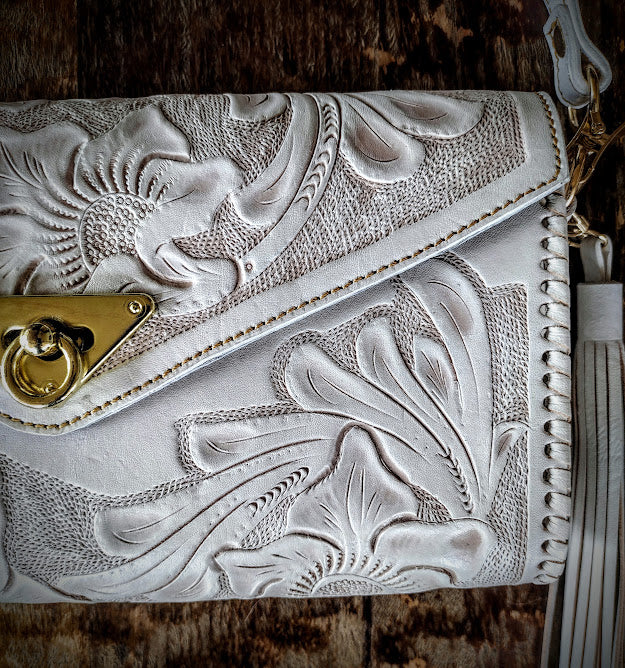 Clutch purse white/wash with shoulder strap.