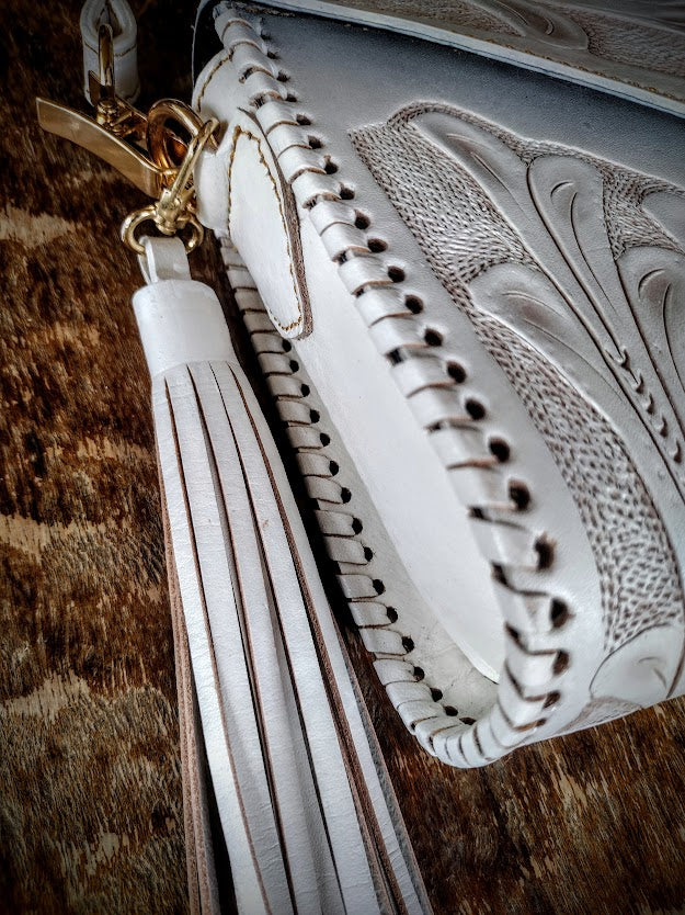 Clutch purse white/wash with shoulder strap.