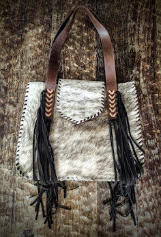 Cowhide beige and brown handbag.