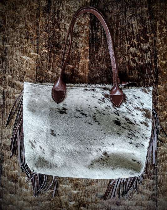 Cowhide beige and brown handbag.