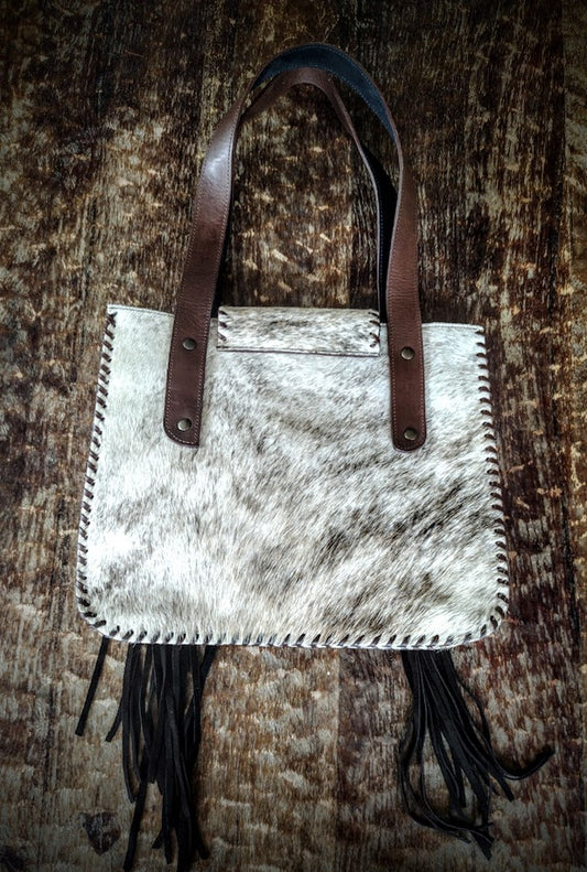 Cowhide beige and brown handbag.