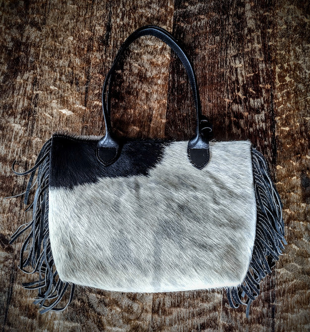 Cowhide black and white hand bag.