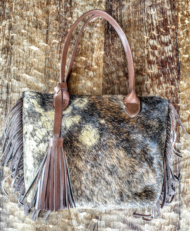 Cowhide hand bag.