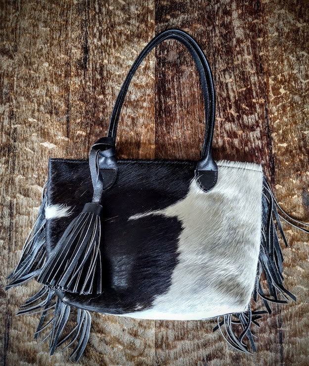 Cowhide black and white hand bag.