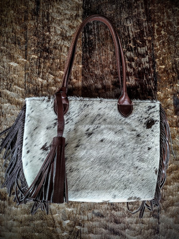 Cowhide beige and brown handbag.