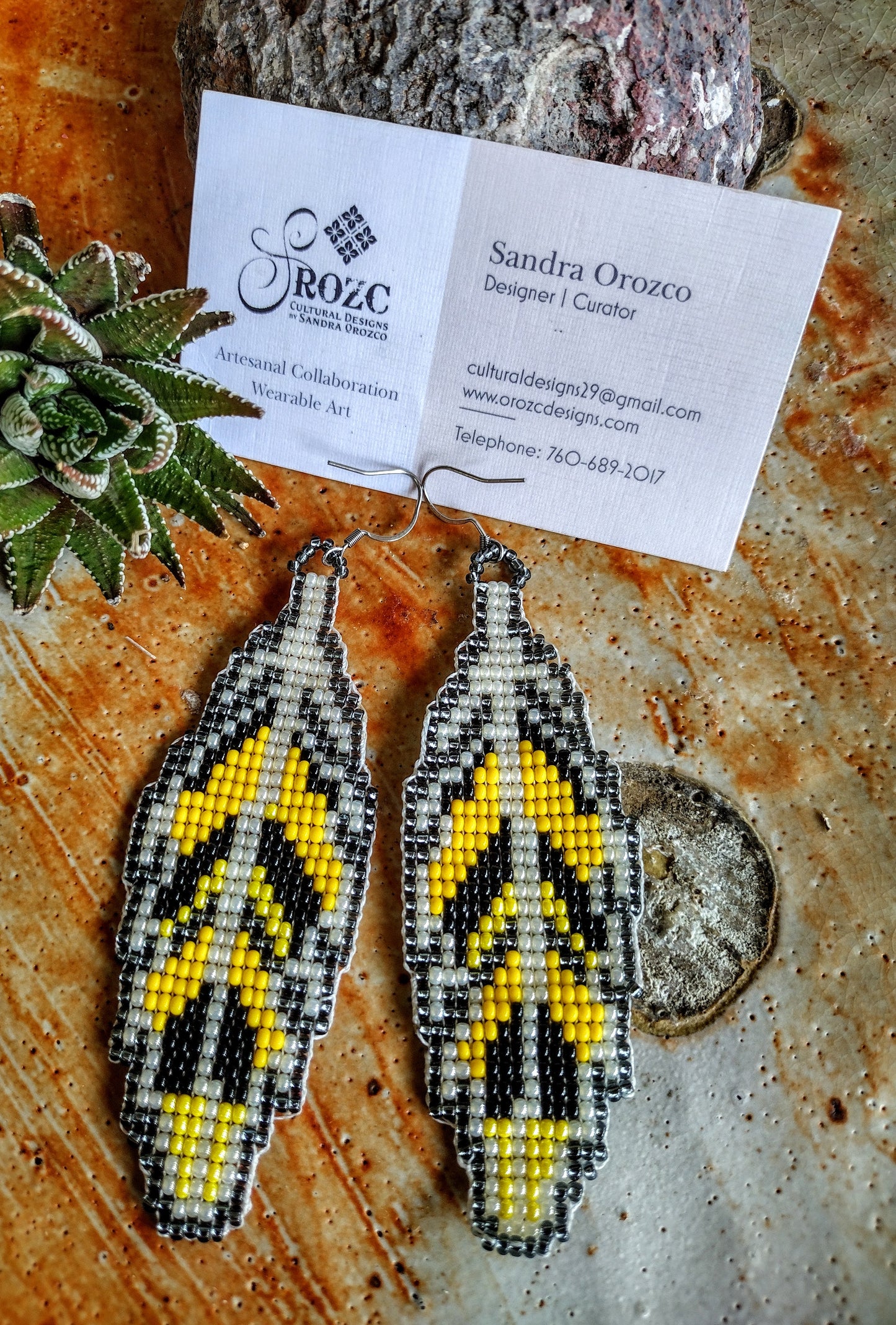 Yellow, black feather beaded earrings
