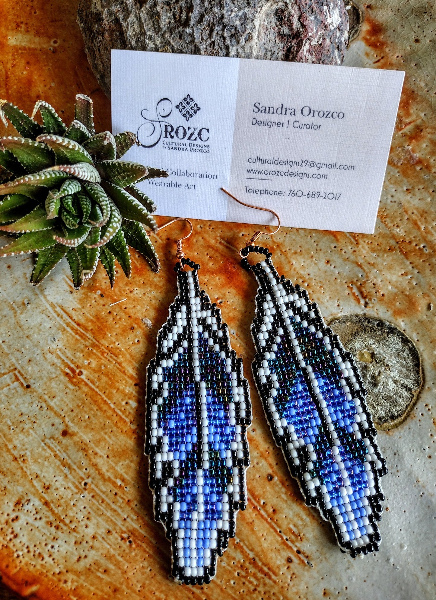 Blue shades feather beaded earrings.