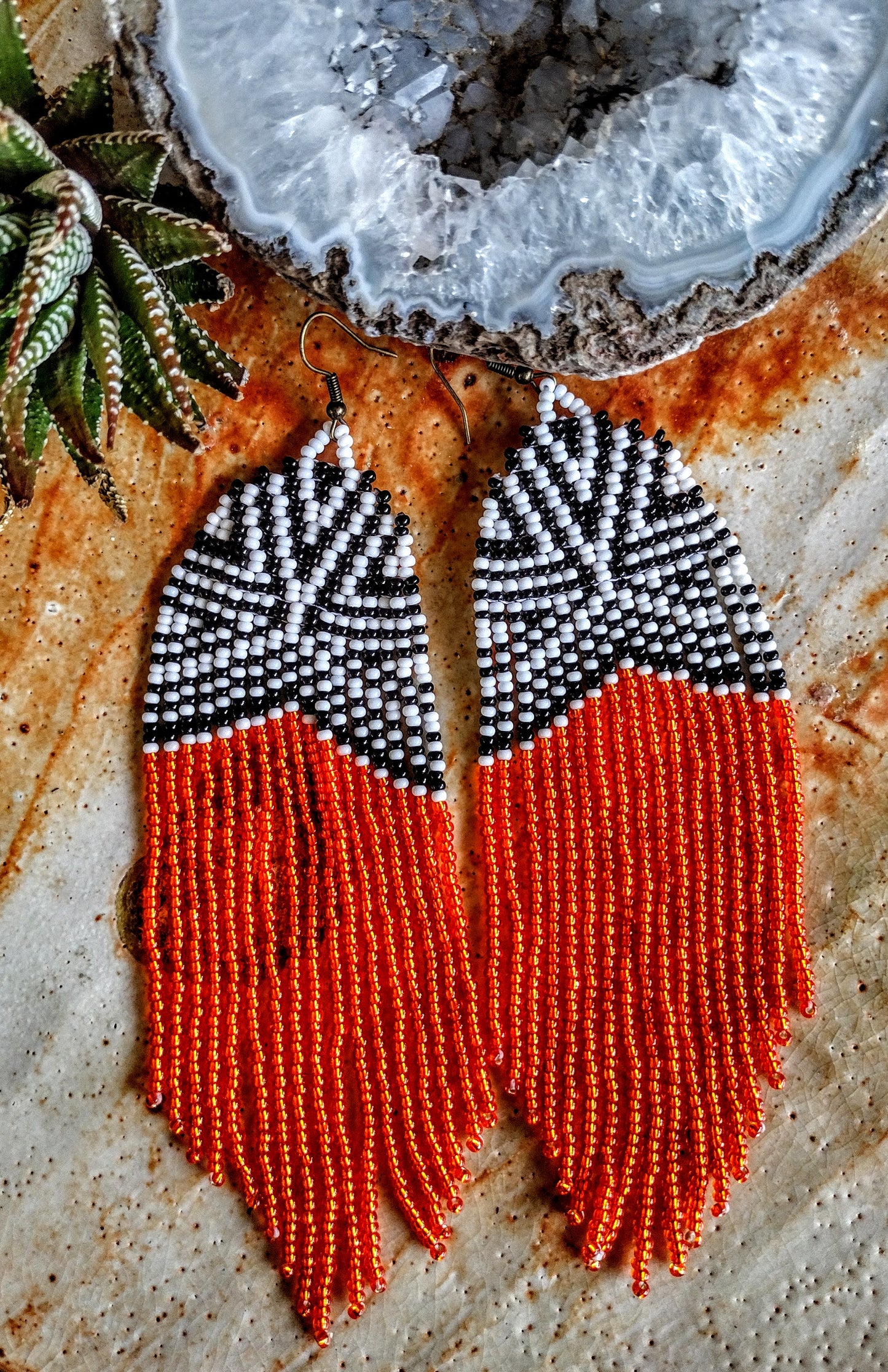 African inspired black, white and orange coper fringe geometrical earrings