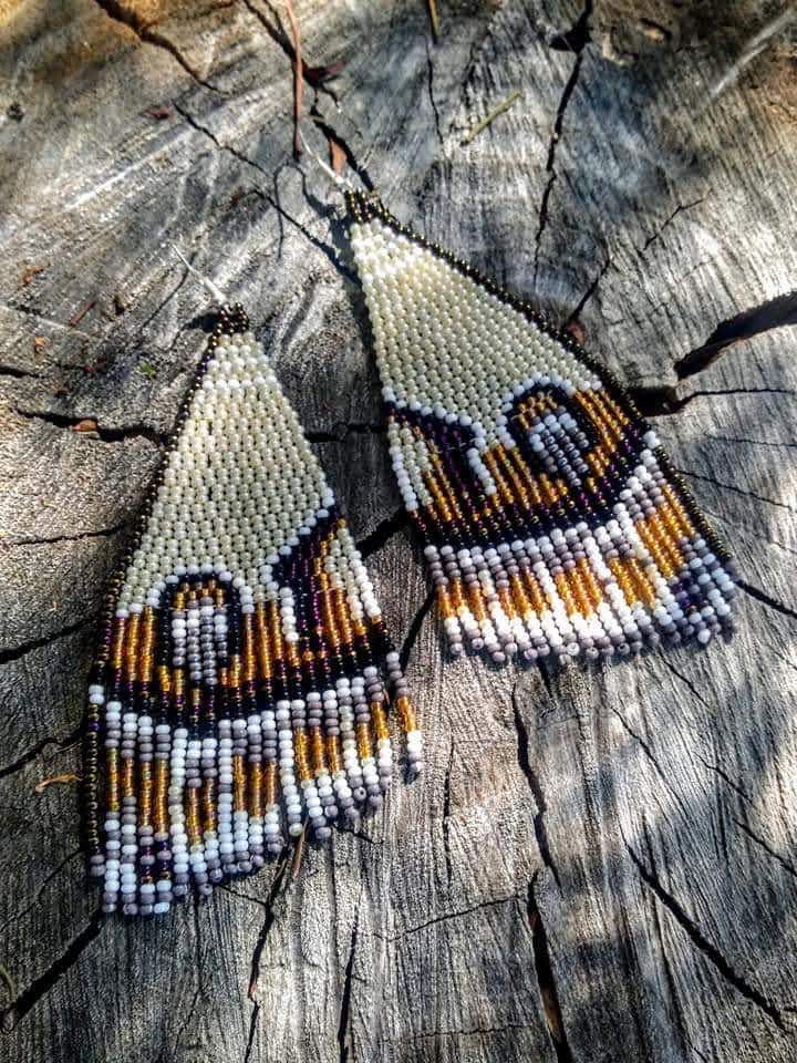 Beige/ brown butterfly wins beaded earrings.