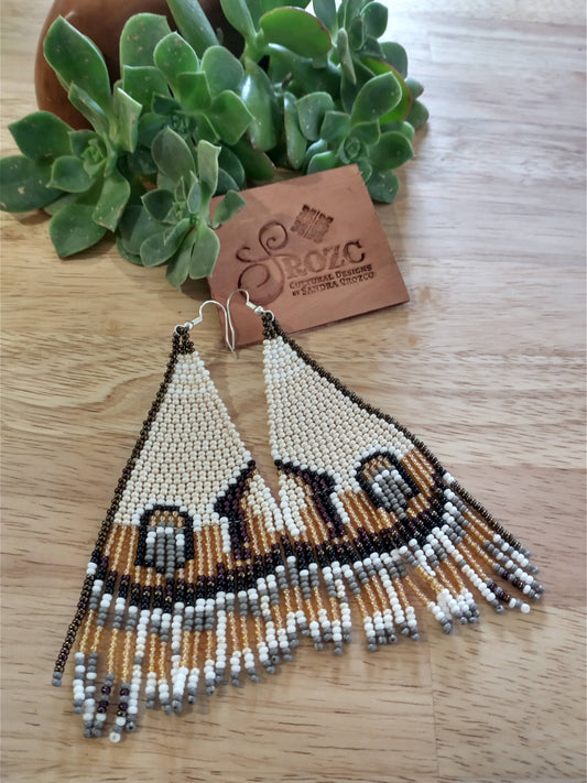 Beige/ brown butterfly wins beaded earrings.
