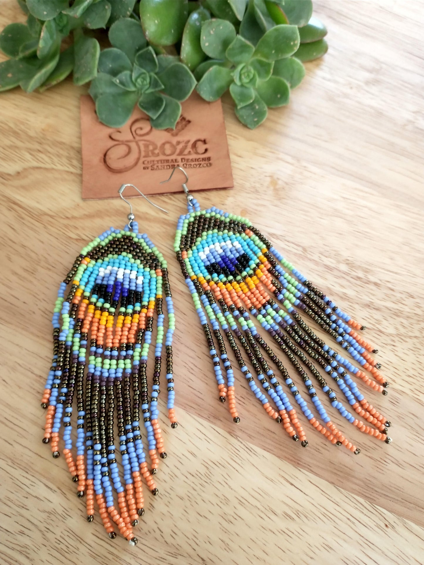 Turquoise Peacock feather beaded earrings.