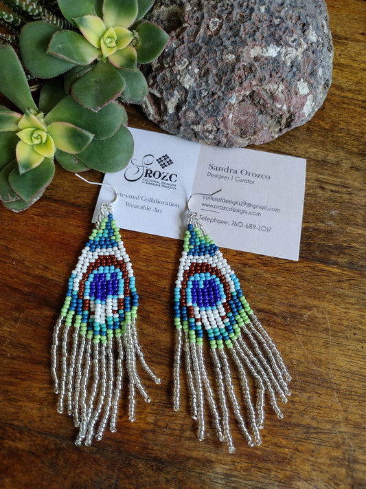 Silver/white peacock feather beaded earrings.
