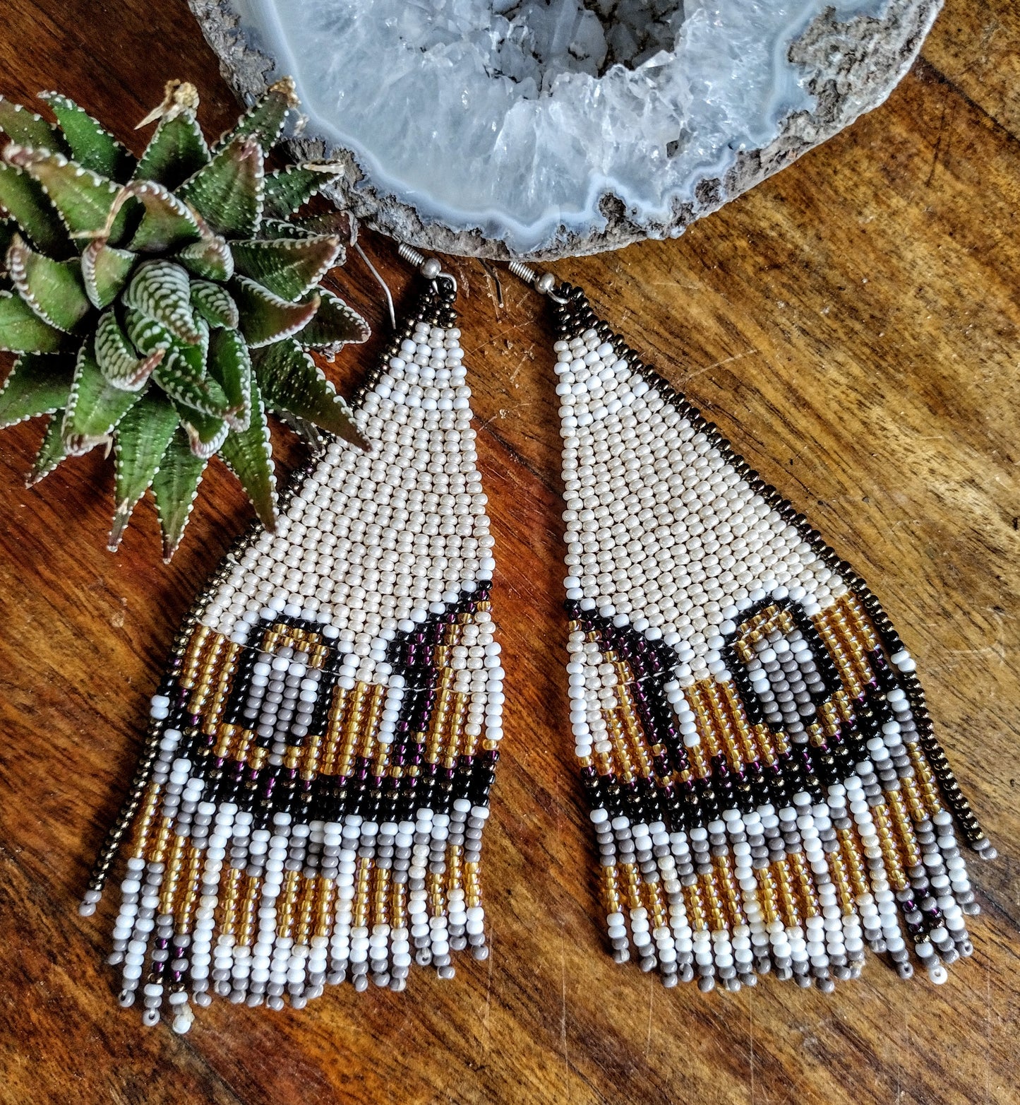Beige/ brown butterfly wins beaded earrings.