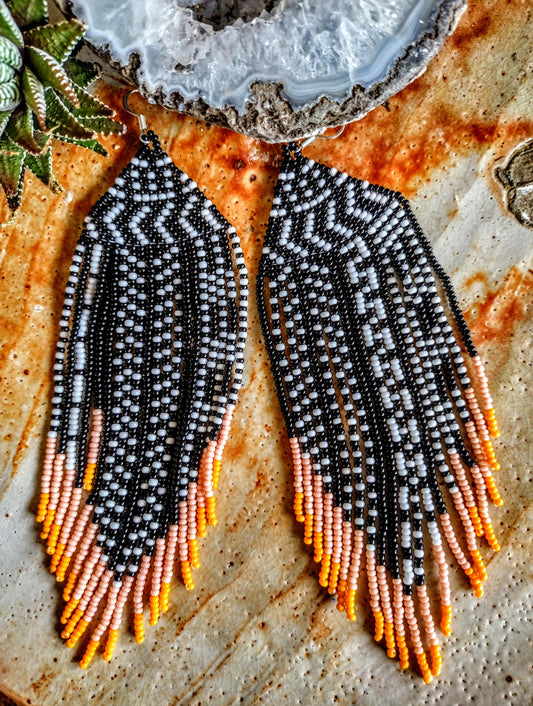 African inspired black, white and orange fringe geometrical earrings